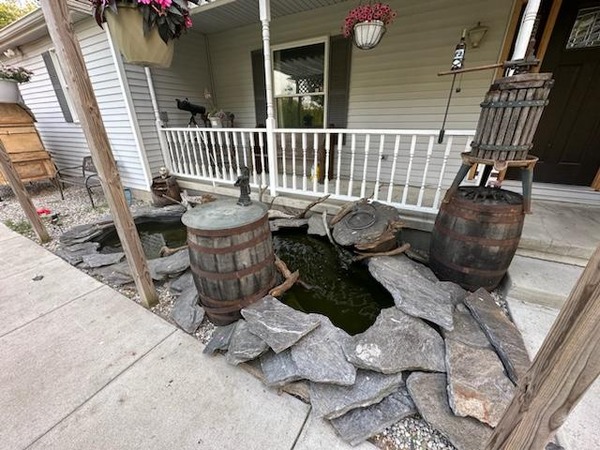 A pond installed next to a client's home.