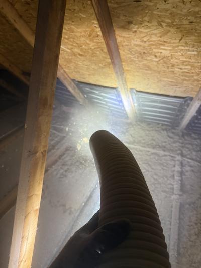 Blow-in insulation in progress