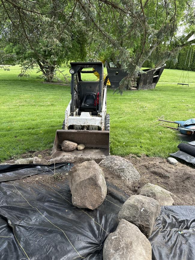 Construction progress on an artificial pond.