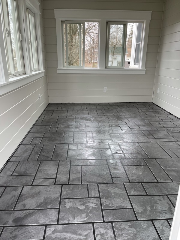 A a tiled sunroom.